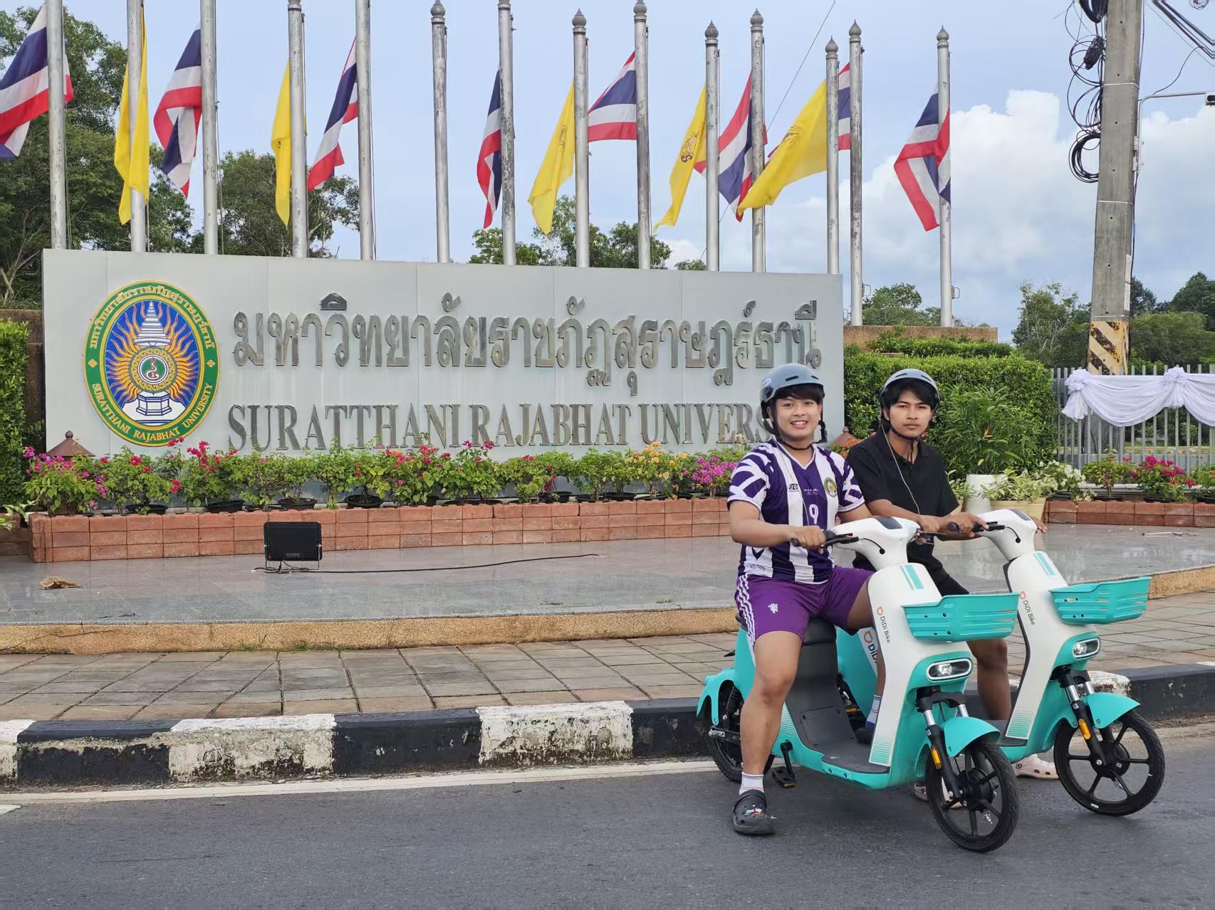 Two students with DiDi Bike at Surat Thani Rajabhat University